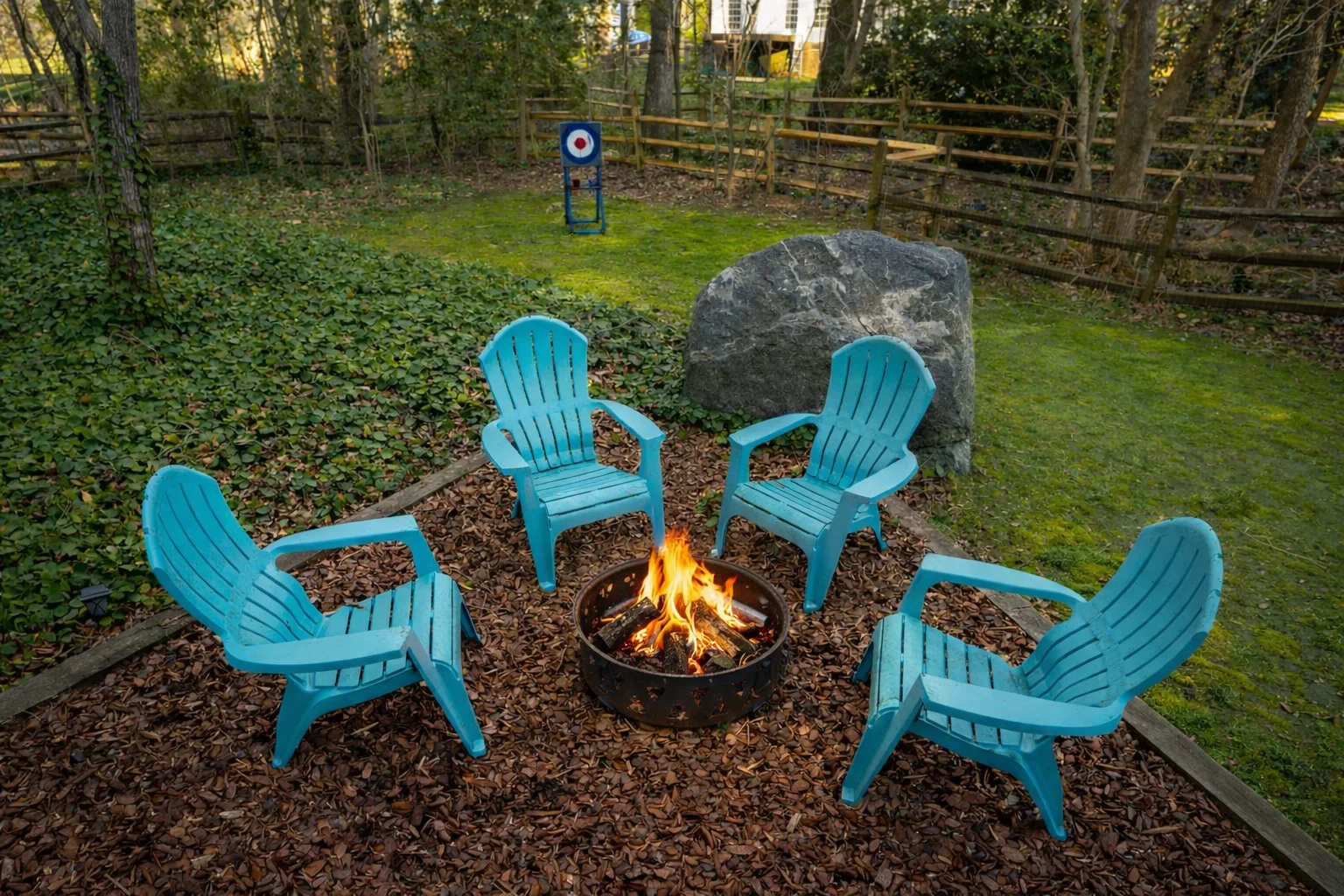 A comfortable fire pit area, offering a peaceful retreat experience with a fenced-in backyard perfect for pets. · Executive Experience A comfortable fire pit area, offering a peaceful retreat experience with a fenced-in backyard perfect for pets. · Executive Experience
