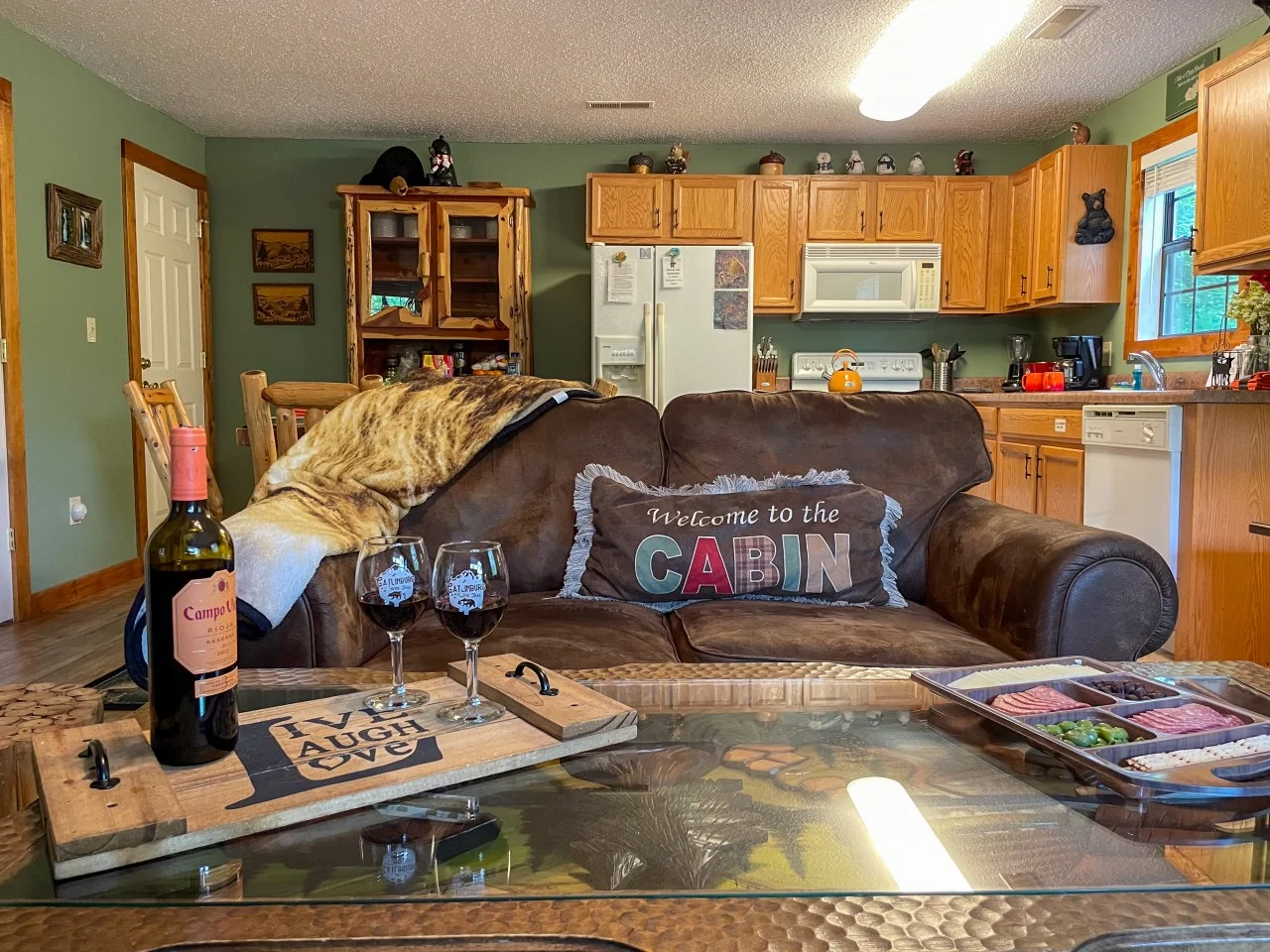 Stone fireplace living room in a Sevierville, TN cabin, a cozy pick for cheap cabin rentals in Sevierville, TN
