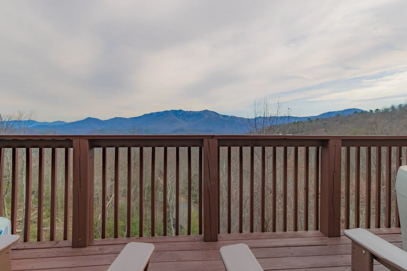 Two deck chairs facing mountain ridges at a Gatlinburg cabin, a quiet base for Gatlinburg couples