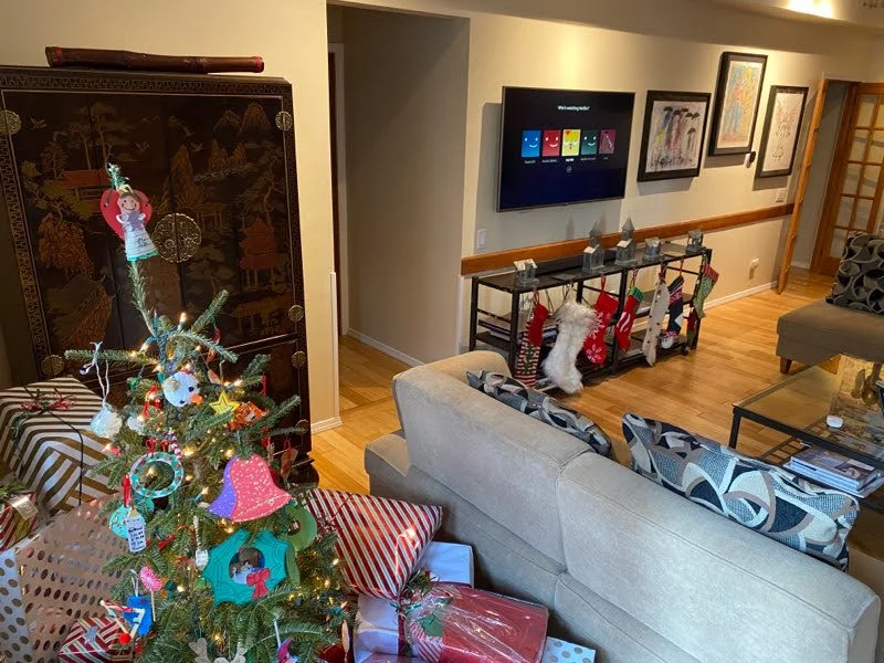 Open-concept living room with brick fireplace, ideal base for a winter wonderland in Chicago IL family trip