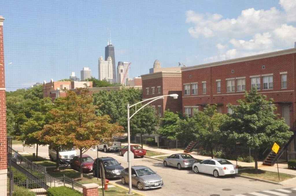 Where to stay in Chicago: tree-lined street near Lincoln Park with Willis Tower skyline view