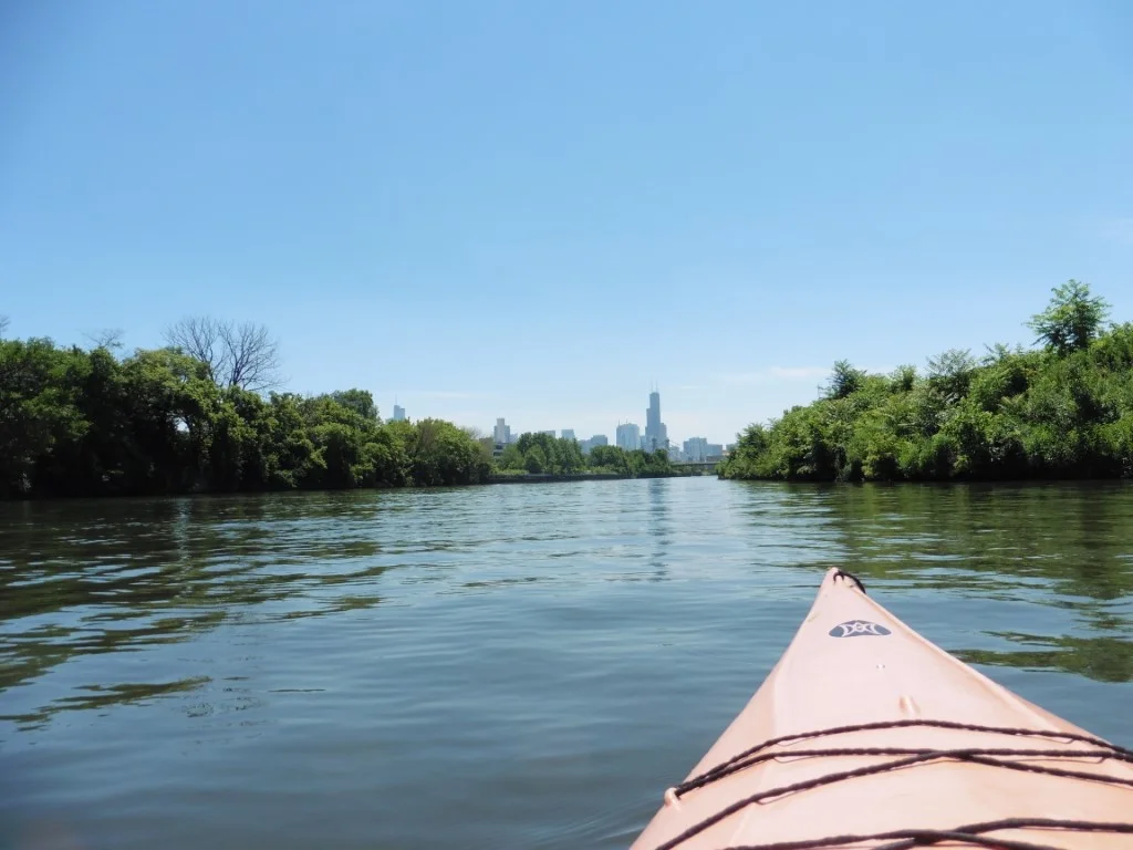 Kayak adventure with city skyline view on calm river in Lincoln Park neighborhood Chicago