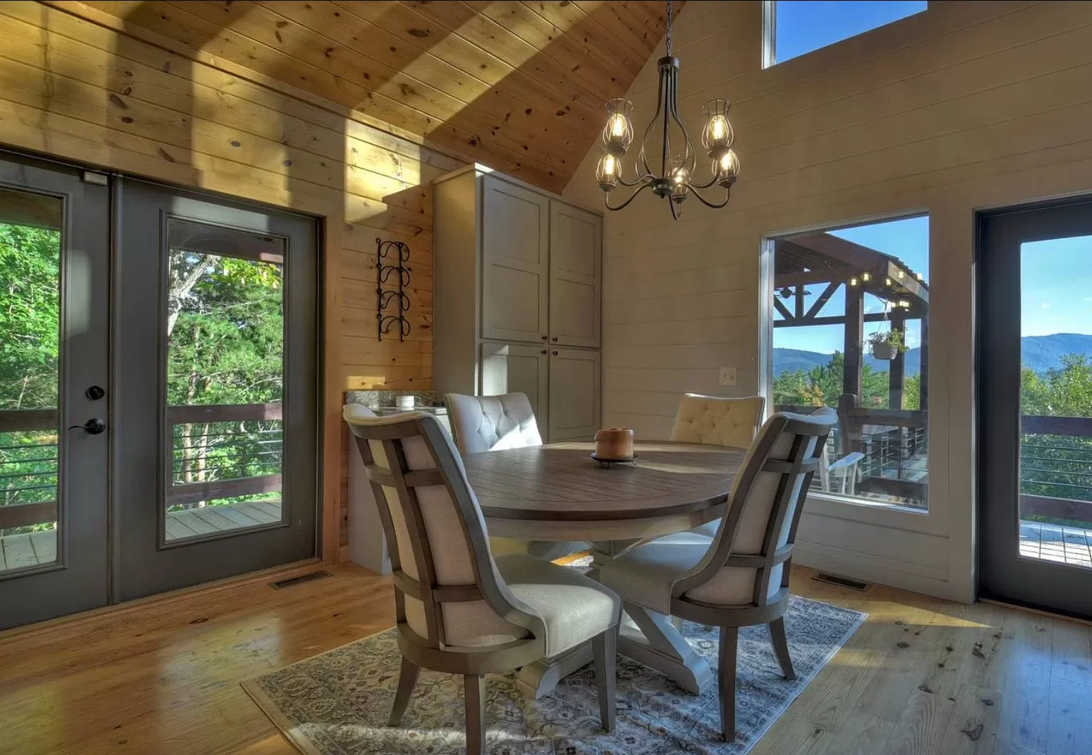 Modern rustic dining room with mountain views at Blue Ridge Georgia vacation rental