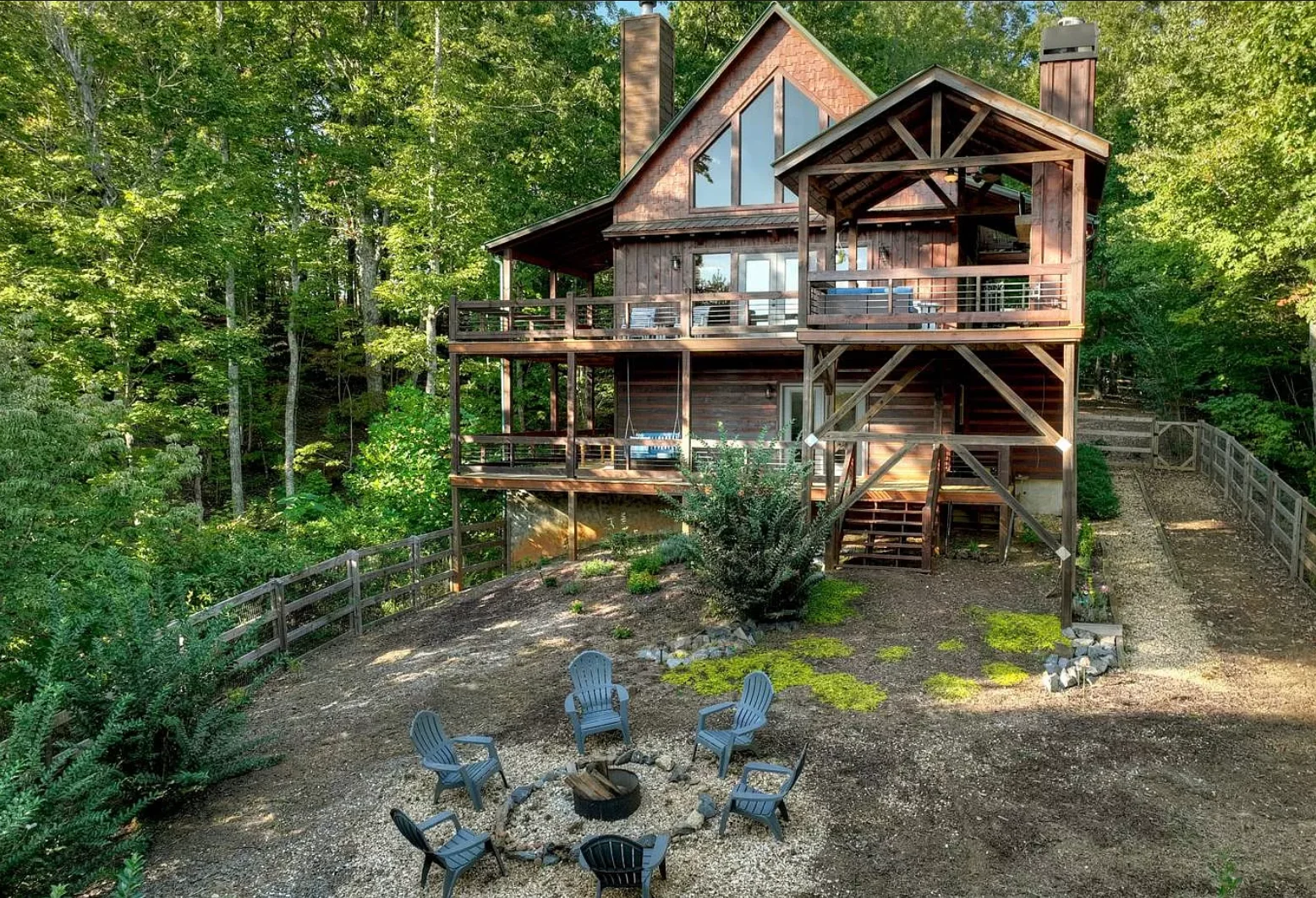 Cabin rental in Blue Ridge GA with fire pit, mountain forest setting, and fenced yard for families and pets