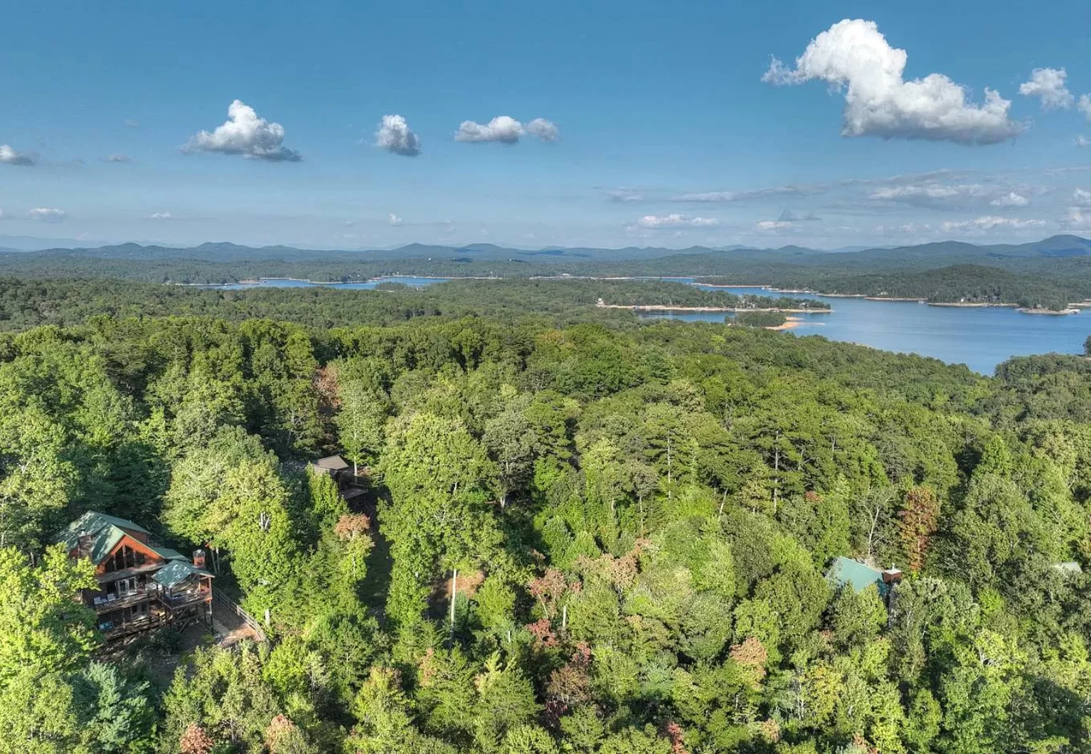 Modern mountain chalet with wooden decks and panoramic mountain views in Blue Ridge, GA
