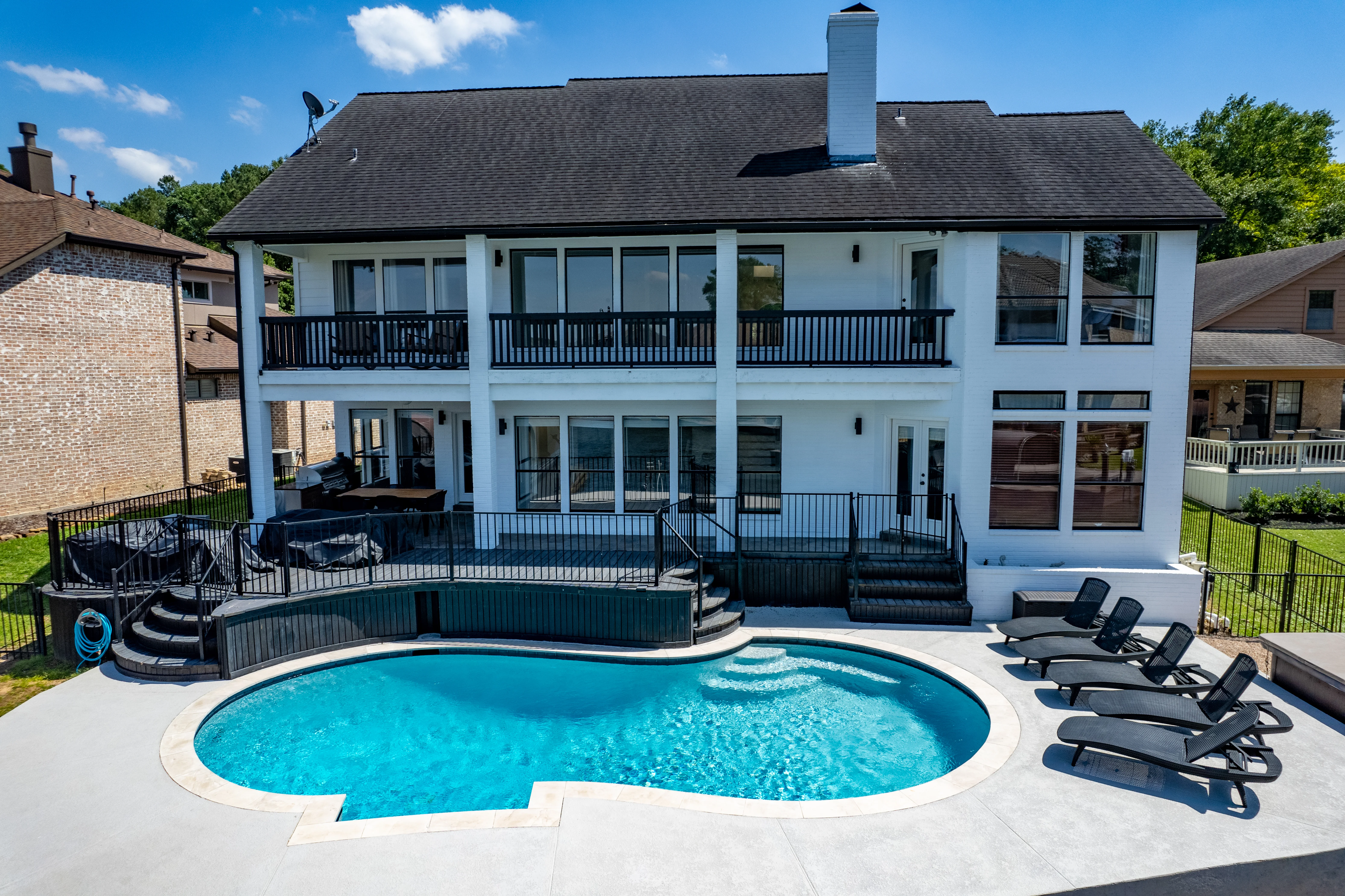 Pool and hot tub at a lakeside villa, among the best Montgomery vacation rentals for groups