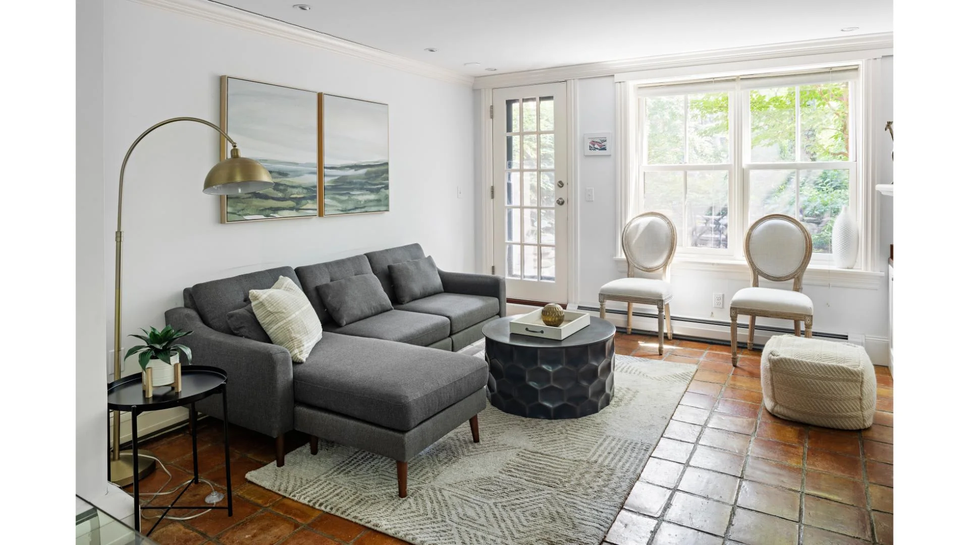 Montgomery Park townhouse living room with gray sectional and patio doors, a South End base for a Boston itinerary