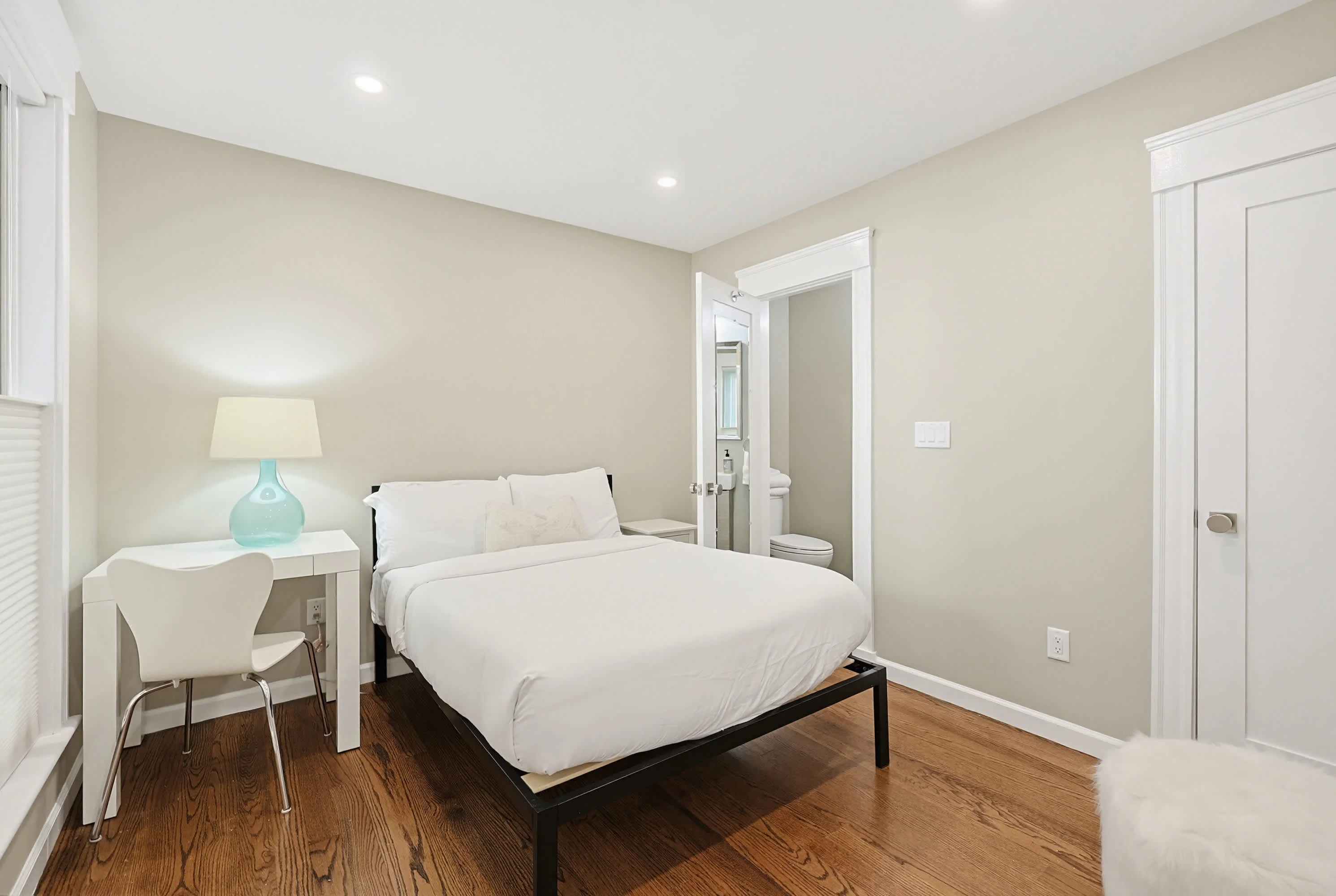 Hardwood-floor bedroom in a Cambridge apartment, a top pick for where to stay in Cambridge