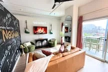 Modern living room with leather sofa and city views in Nashville loft
