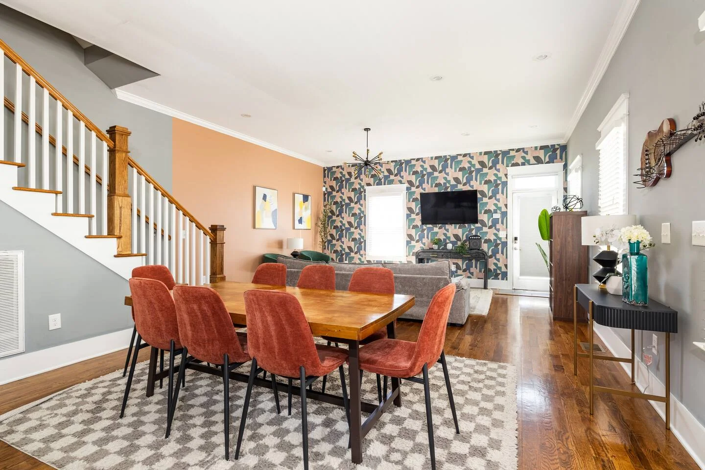 Modern open-concept living room with dining area where to stay in Nashville TN