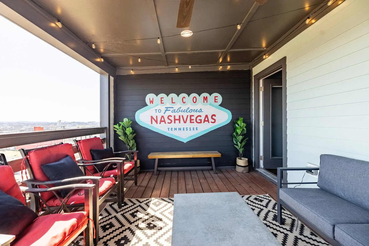 Rooftop patio with retro Nashvegas sign and city views at best bachelor party venues Nashville