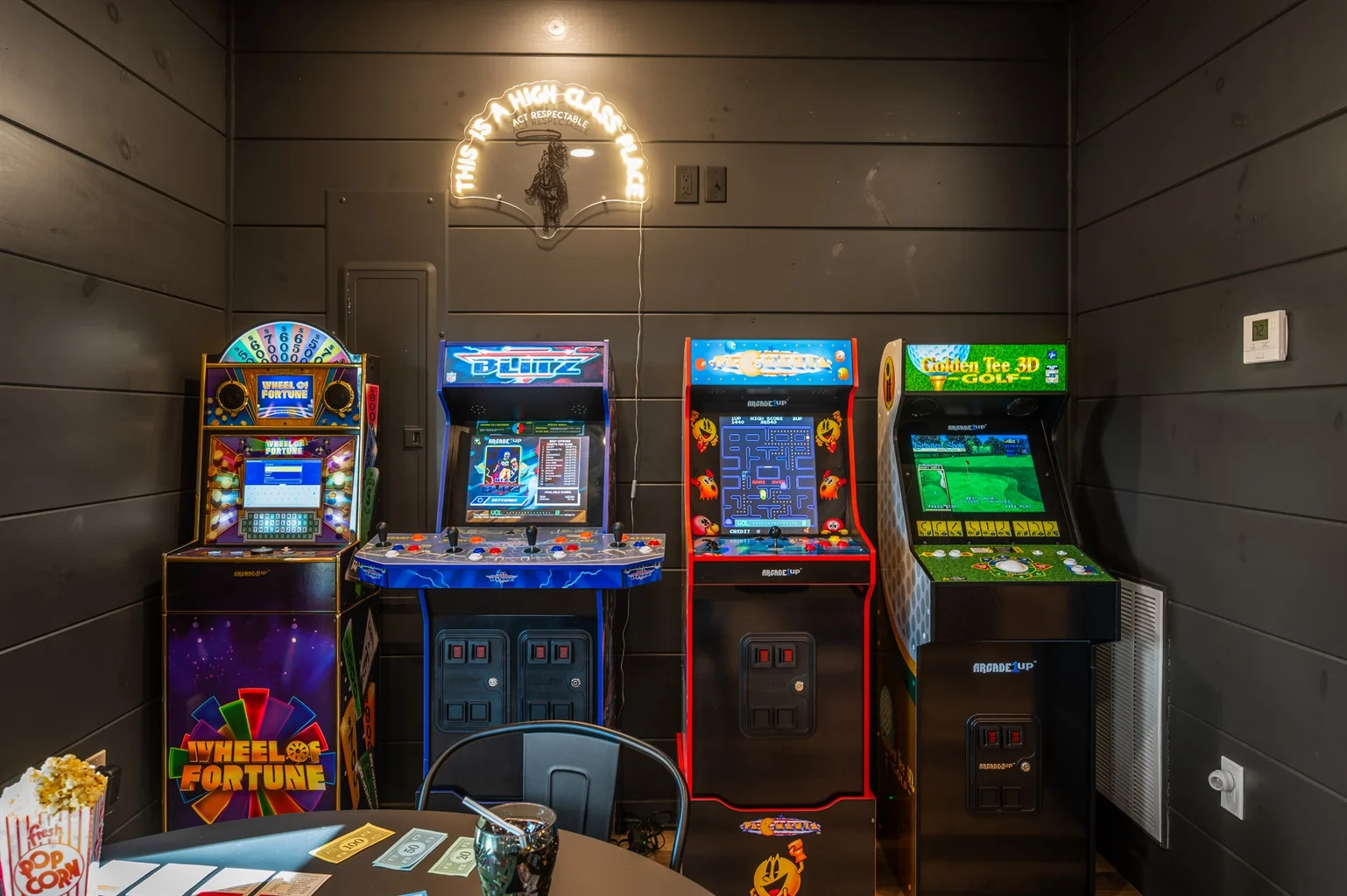 Game room with vintage arcade machines and entertainment center at best vacation rentals Pigeon Forge Tennessee
