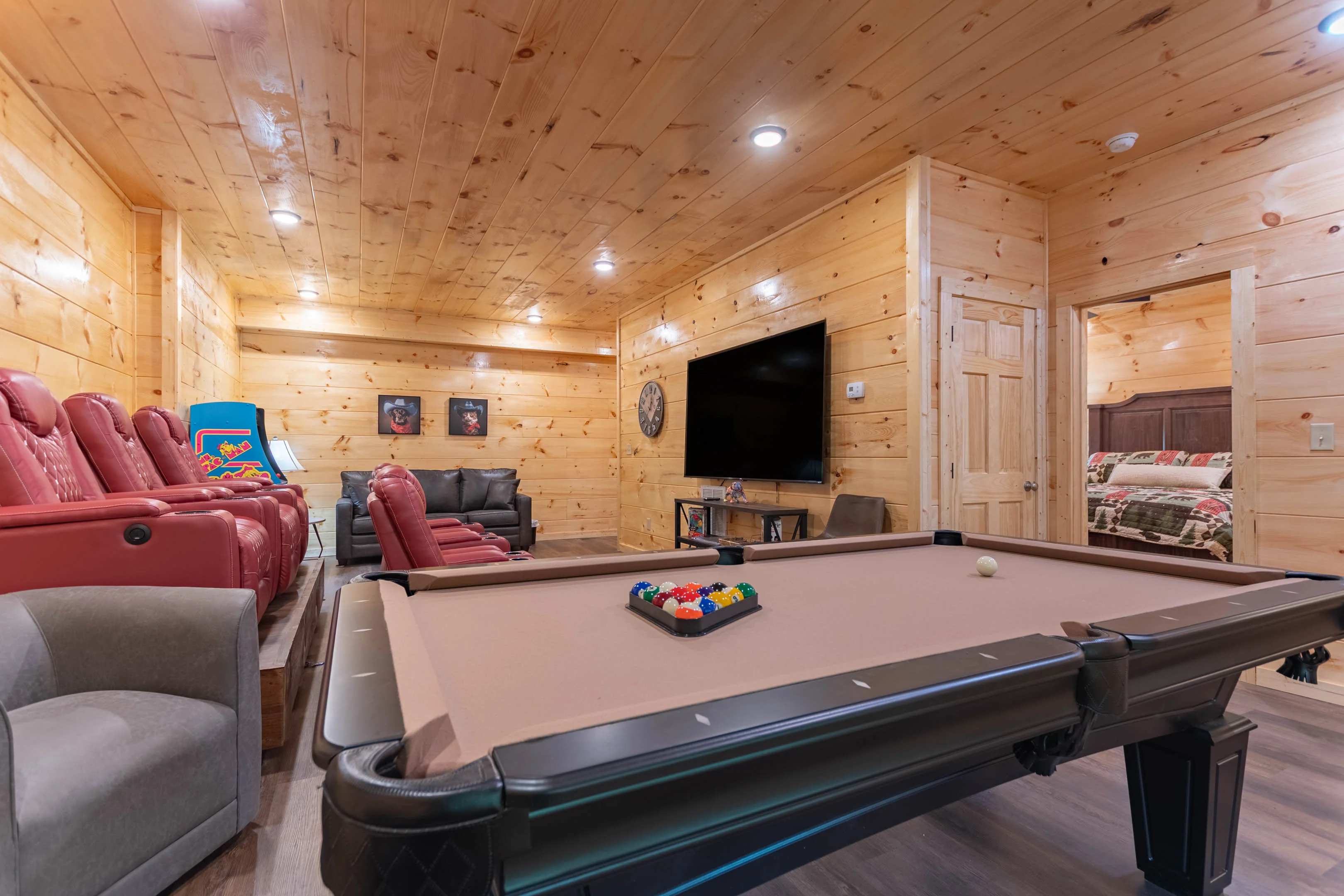 Pigeon Forge cabin with private pool and game room featuring pool table and entertainment center