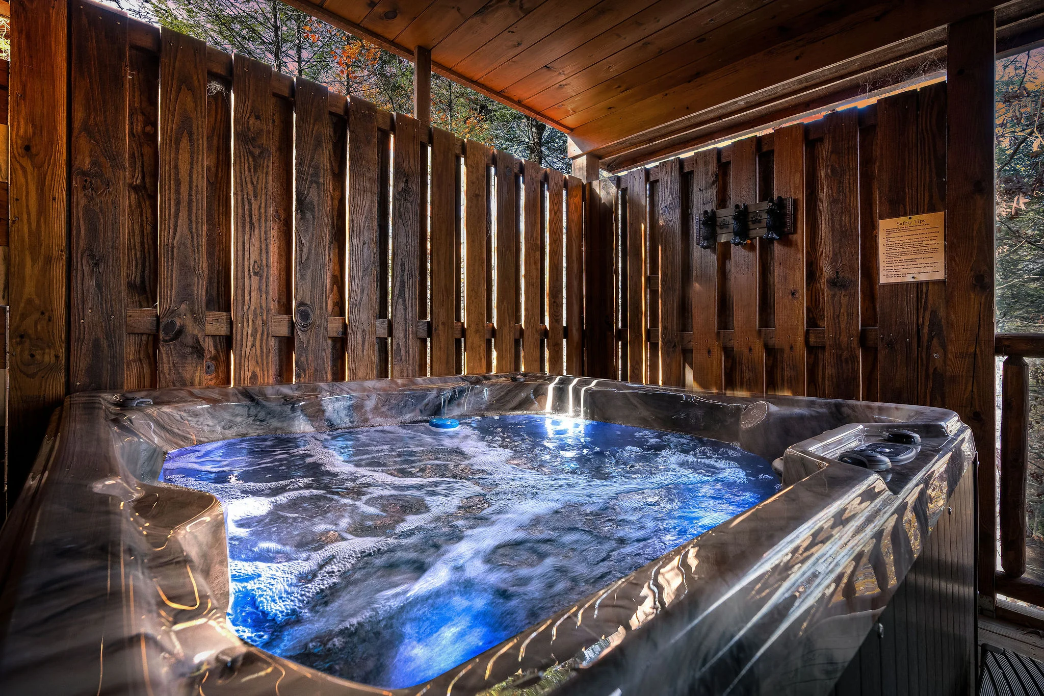 Private outdoor hot tub at Black Bear Getaway cabin rental near Pigeon Forge Tennessee in Smoky Mountain setting