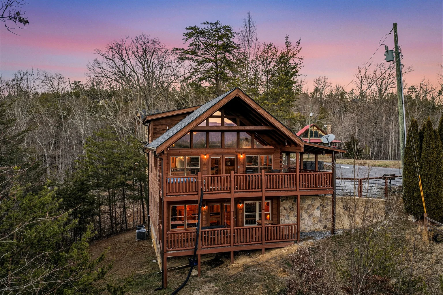Two-story log cabin with wrap-around decks in Pigeon Forge TN rod run weekend retreat near LeConte Center