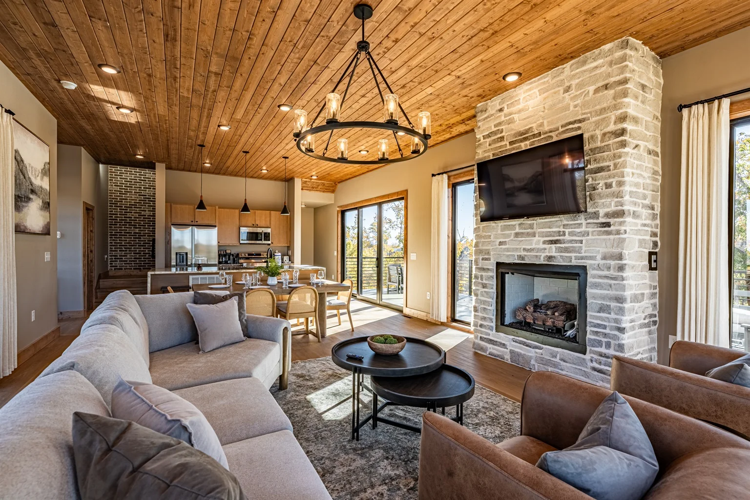 Luxury living room with stone fireplace and mountain views - perfect cabins in Tennessee for couples