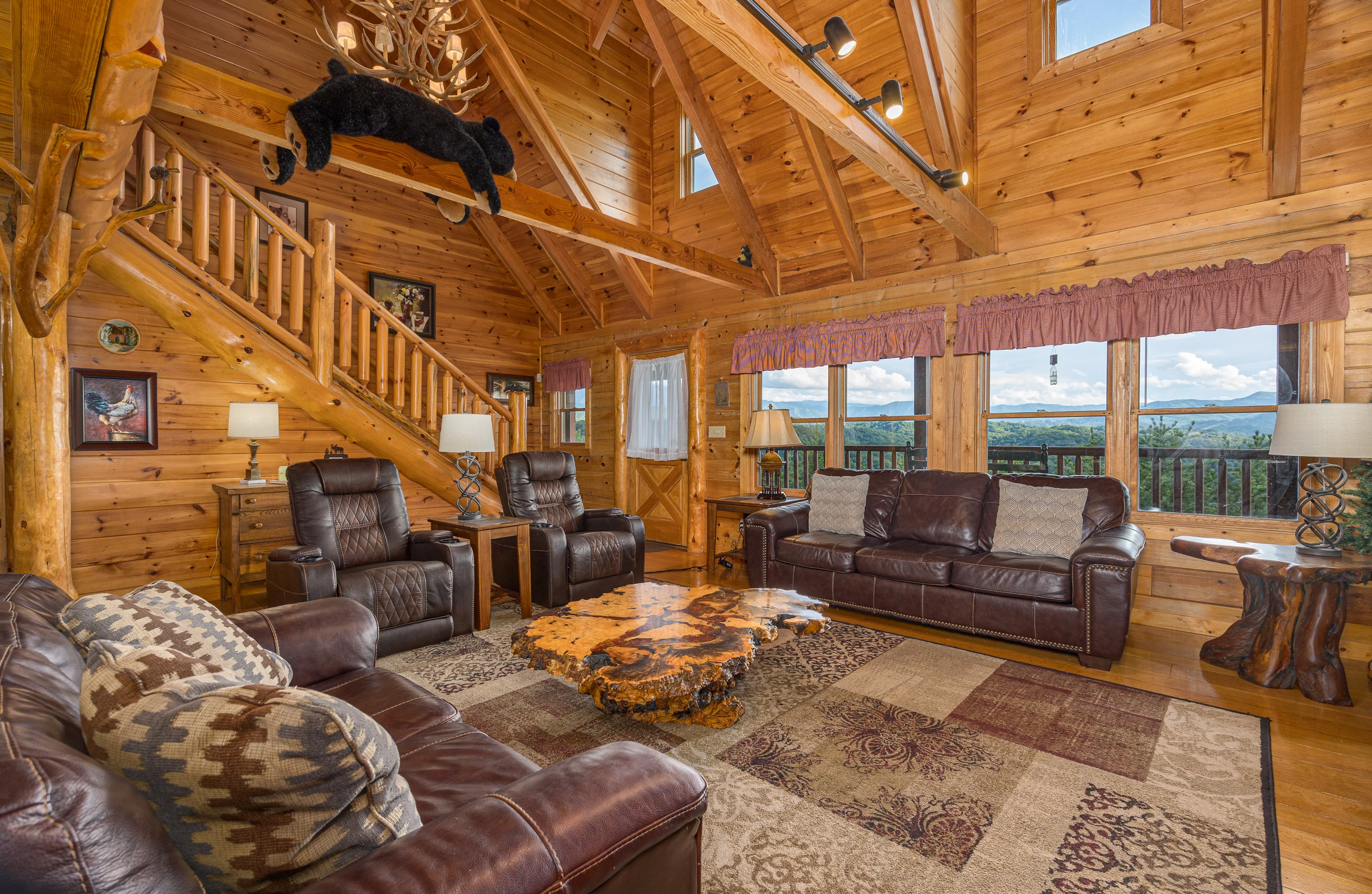 Log cabin living room with mountain views, ideal base for Dollywood opening day 2026 in Pigeon Forge