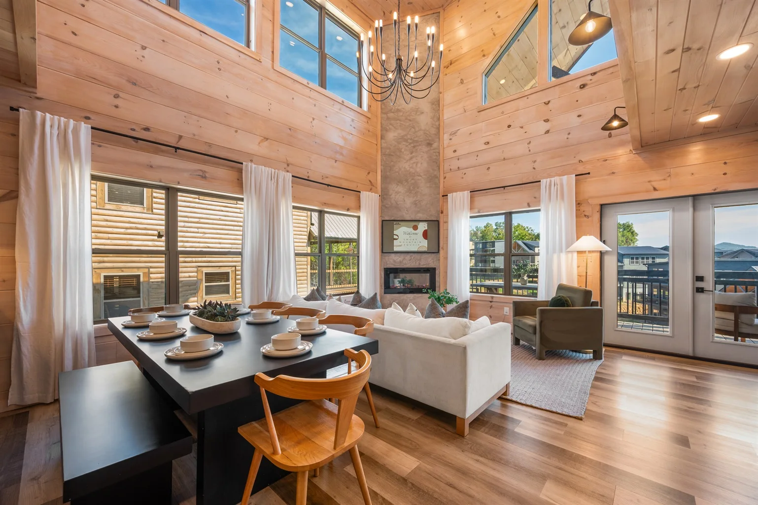 Modern log cabin living room with vaulted ceilings and panoramic mountain views for direct booking Gatlinburg TN