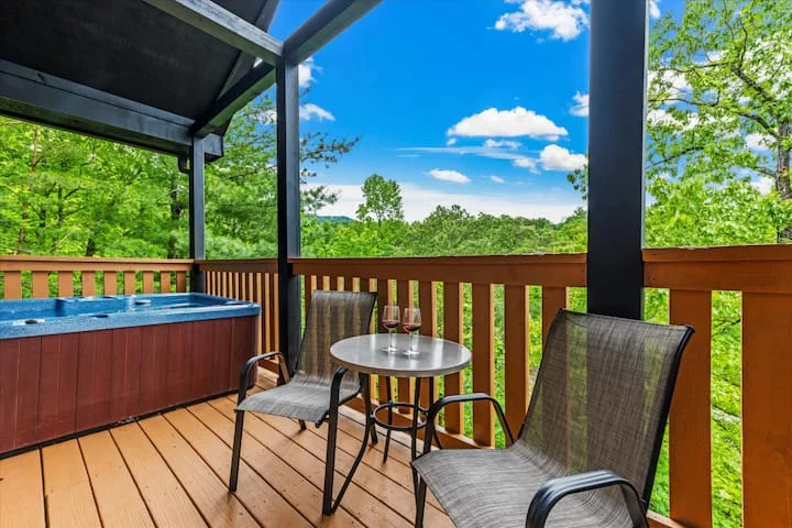 Pigeon Forge TN cabin deck with hot tub and mountain views perfect for nightlife and evening relaxation