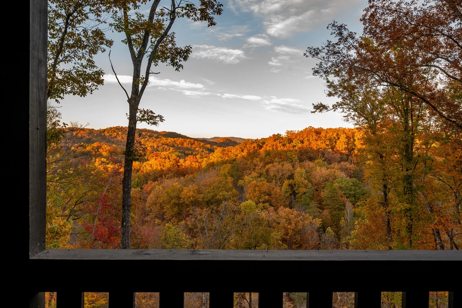Autumn mountain vista with fall foliage viewed from a cabin porch in Sevierville TN Smoky Mountains