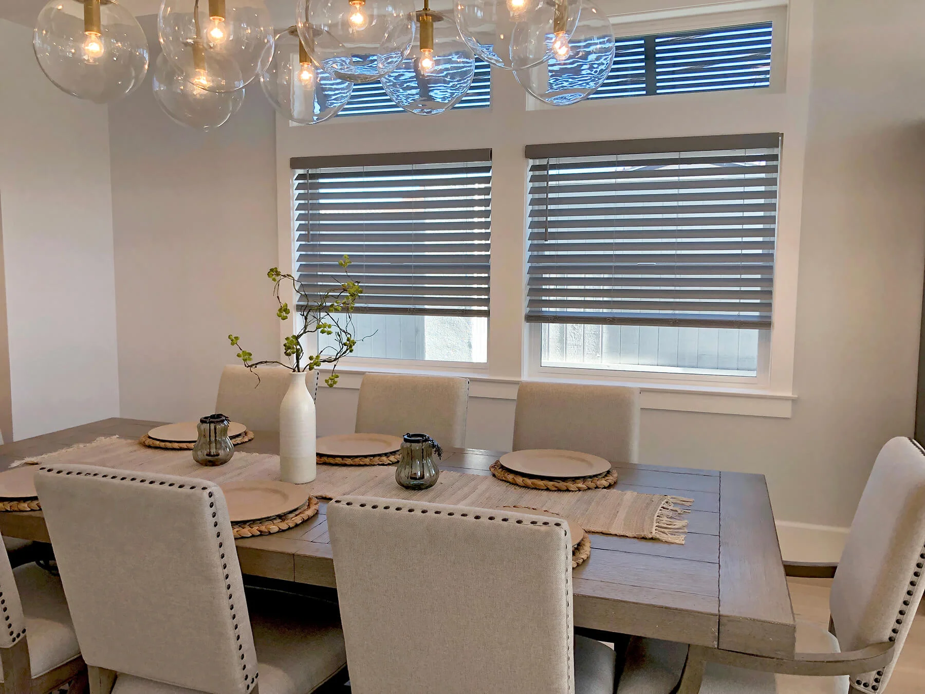 Modern Annapolis dining room with contemporary striped Hunter and Douglas shades on large windows filtering natural light