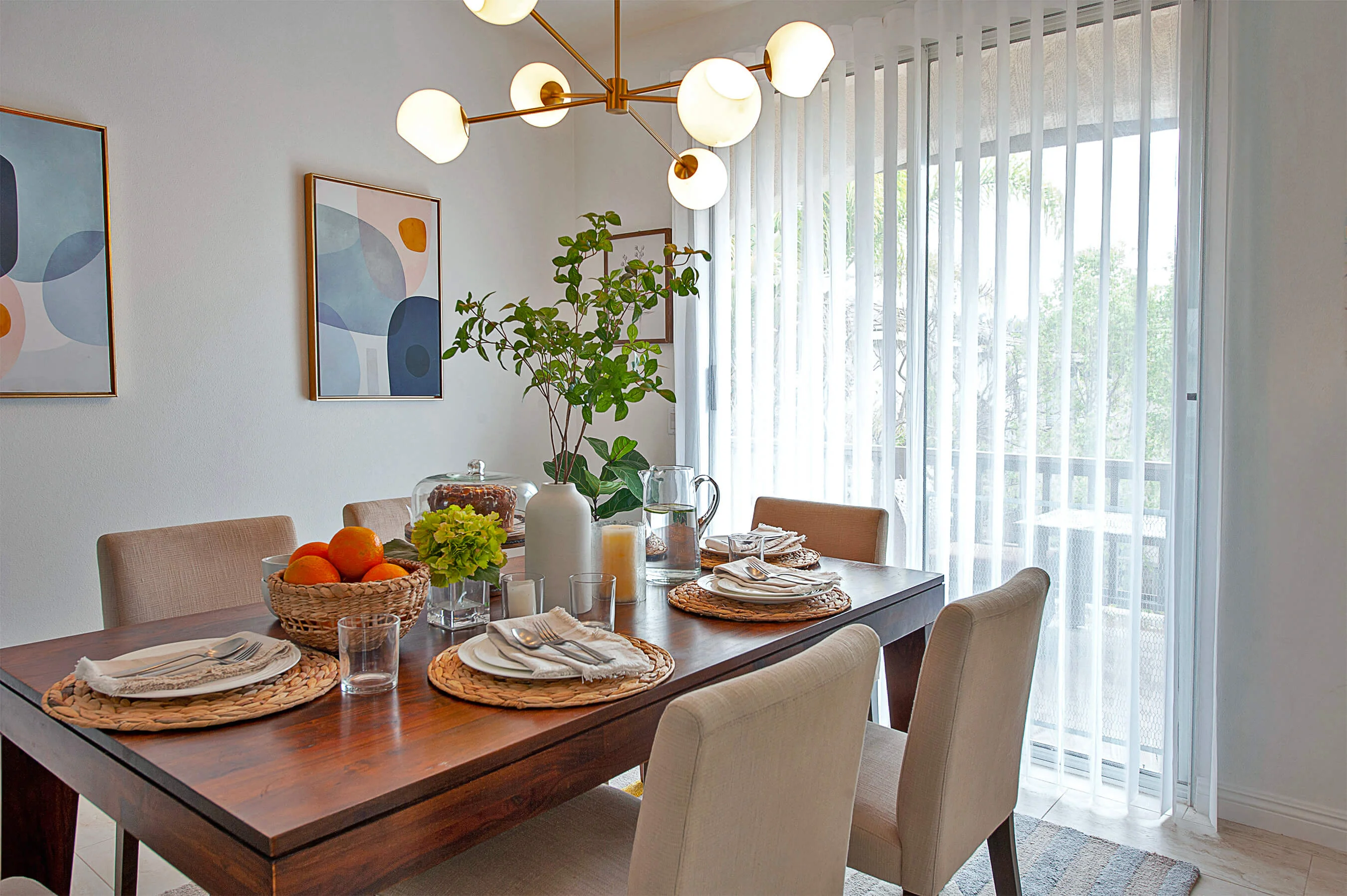 Modern dining room in Annapolis coastal home with vertical blinds and natural light showcasing window treatment options for
