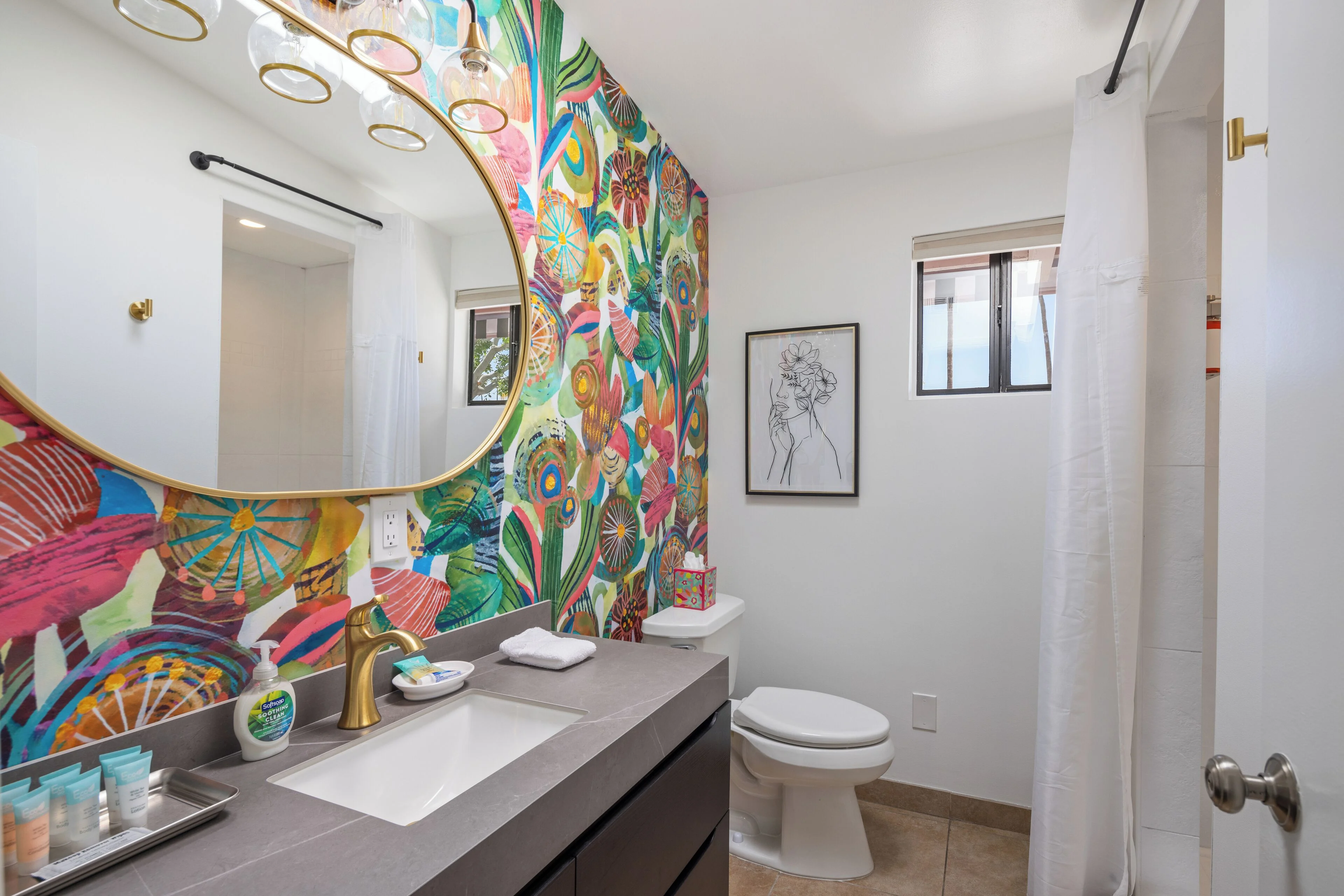 Modern bathroom with colorful geometric wallpaper at dog friendly hotel in Palm Springs