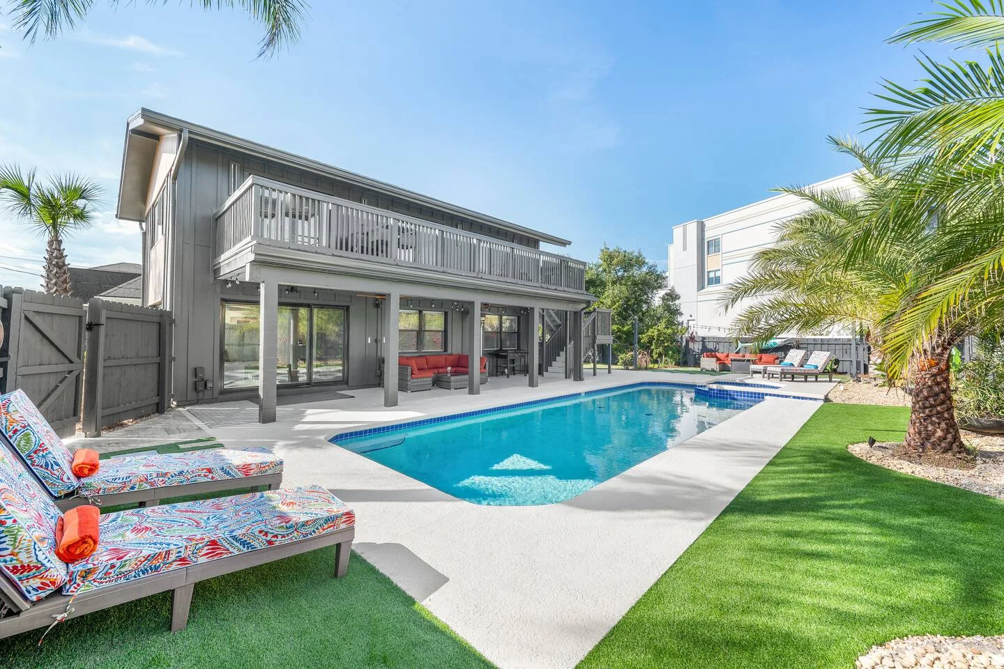 Luxury pool with tropical landscaping and modern architecture in St. Augustine vacation rental property