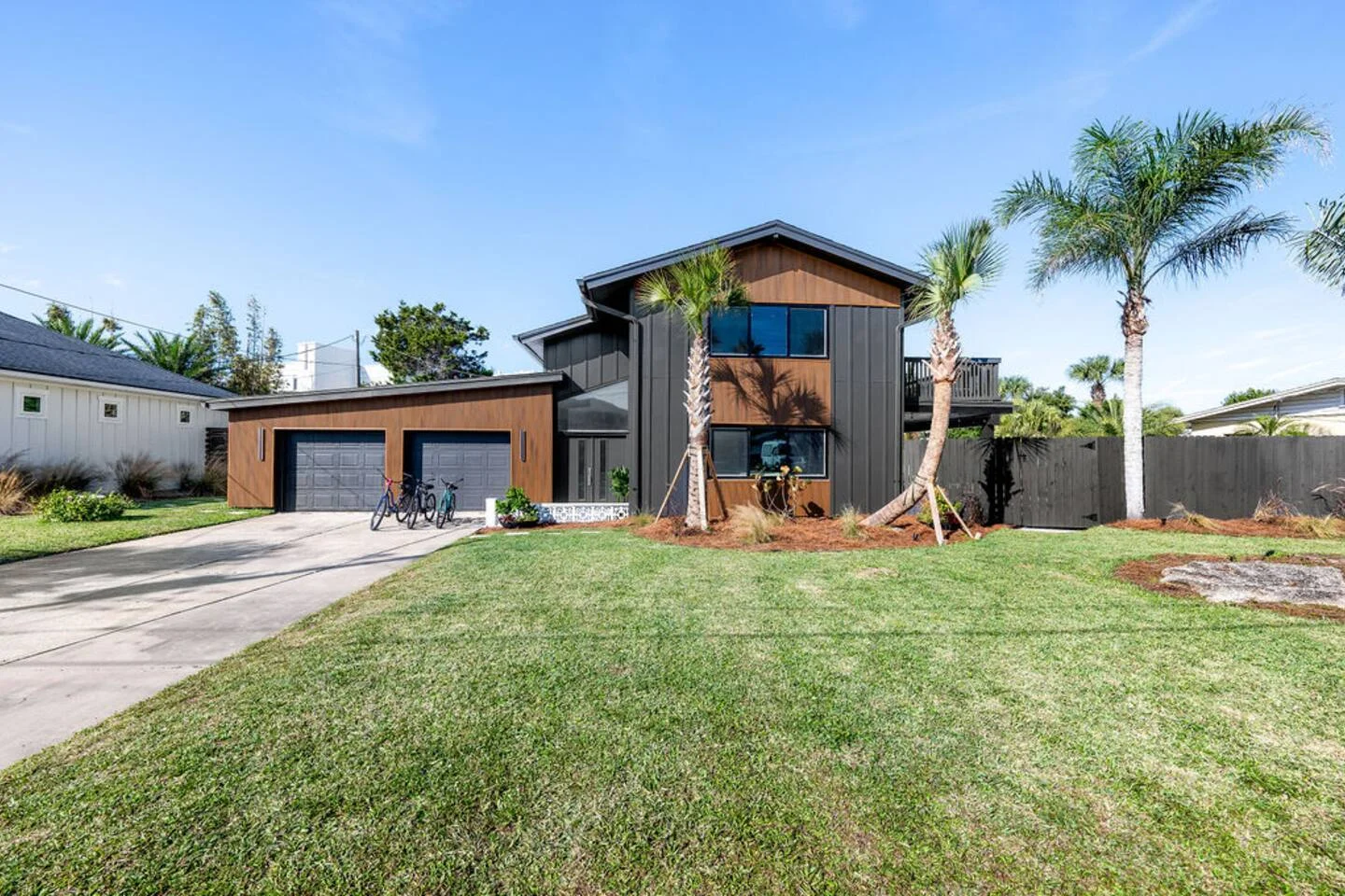 Modern coastal home exterior in St Augustine Florida rental property tour showing contemporary two-story architecture with