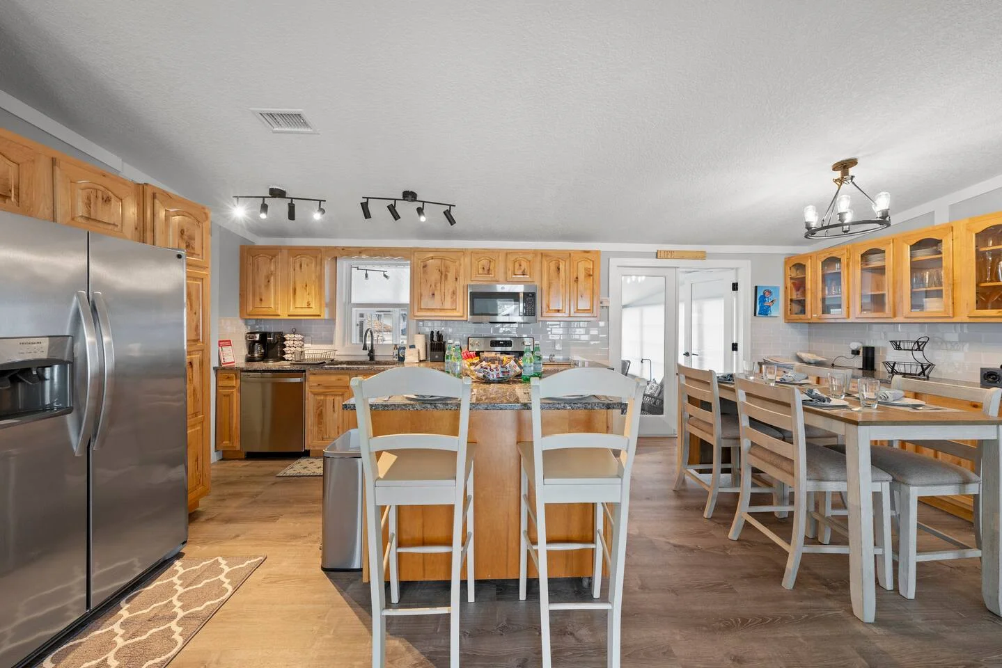Modern kitchen with granite countertops and wood cabinetry where a property owner could manage their St. Augustine rental