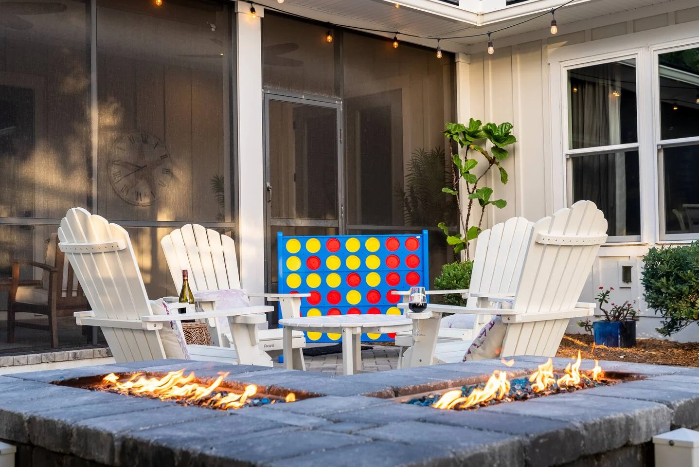 Modern patio with fire pit and Adirondack chairs for entertaining, helping property owners compare landlord investment
