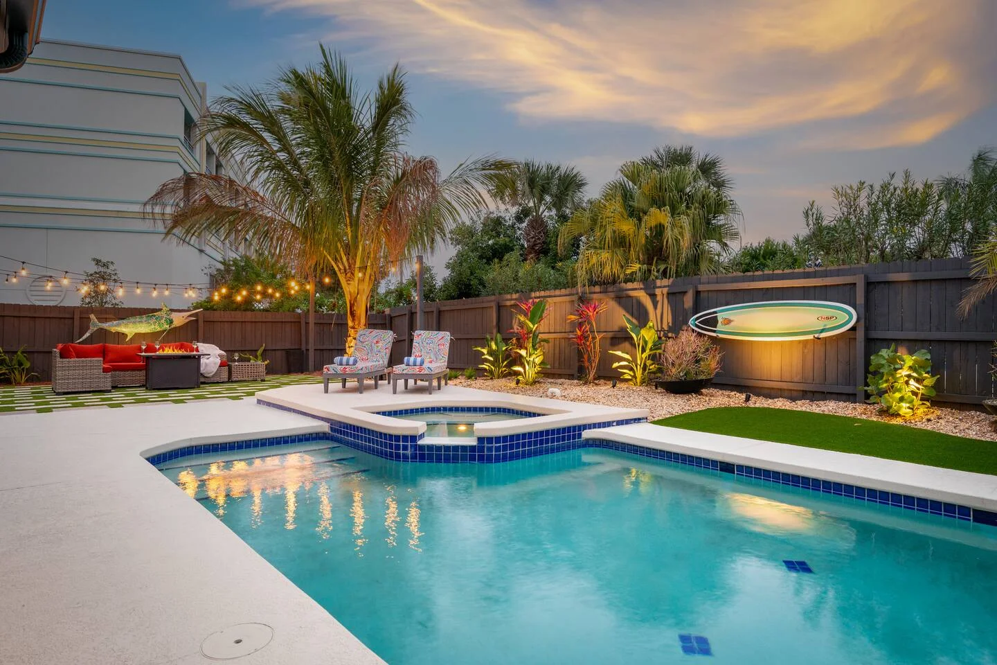 Luxury backyard pool with spa and tropical landscaping representing the hidden costs of self-managing vacation rental