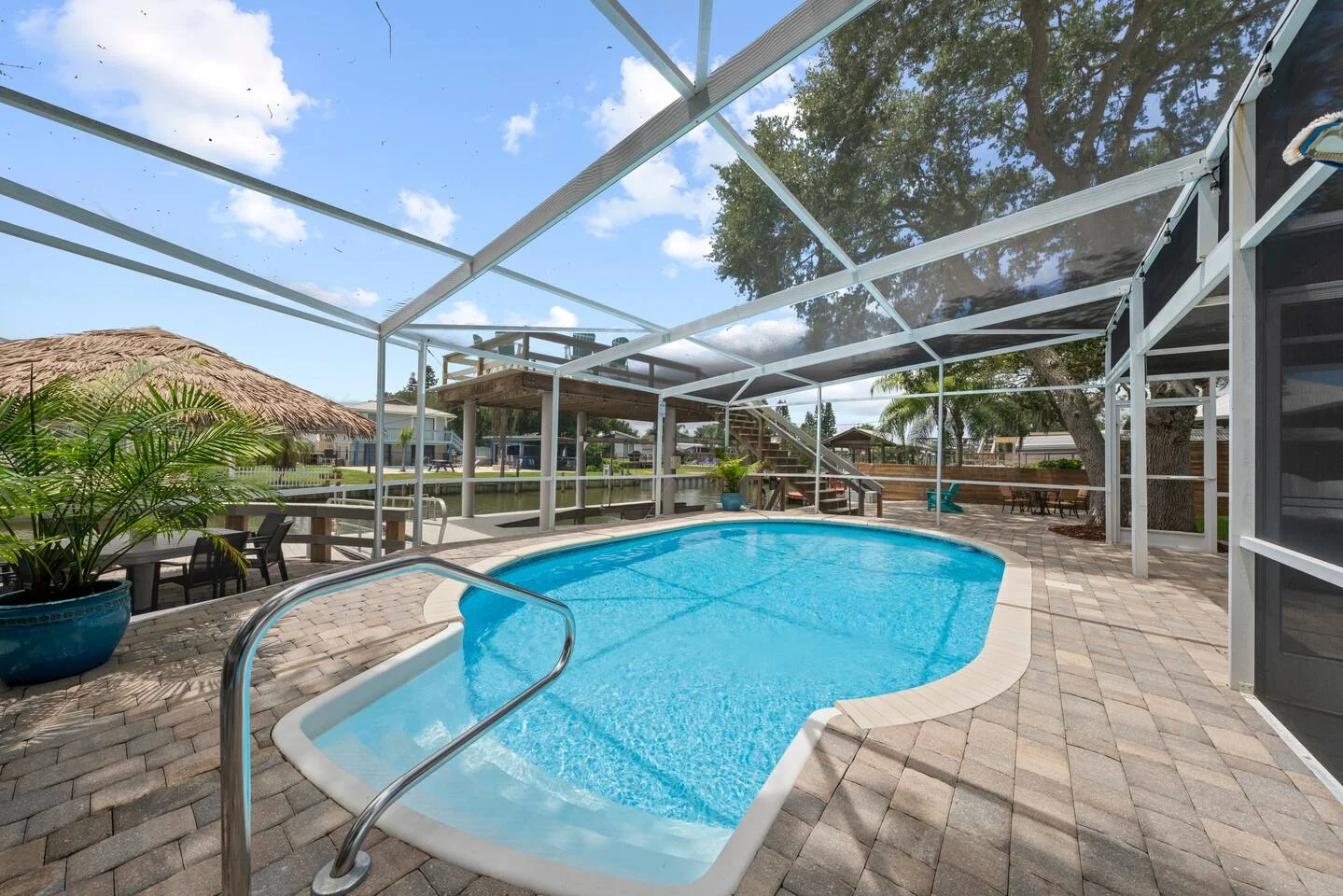 Luxury screened pool with spa tub overlooking waterfront in Historic St Augustine Florida vacation rental district