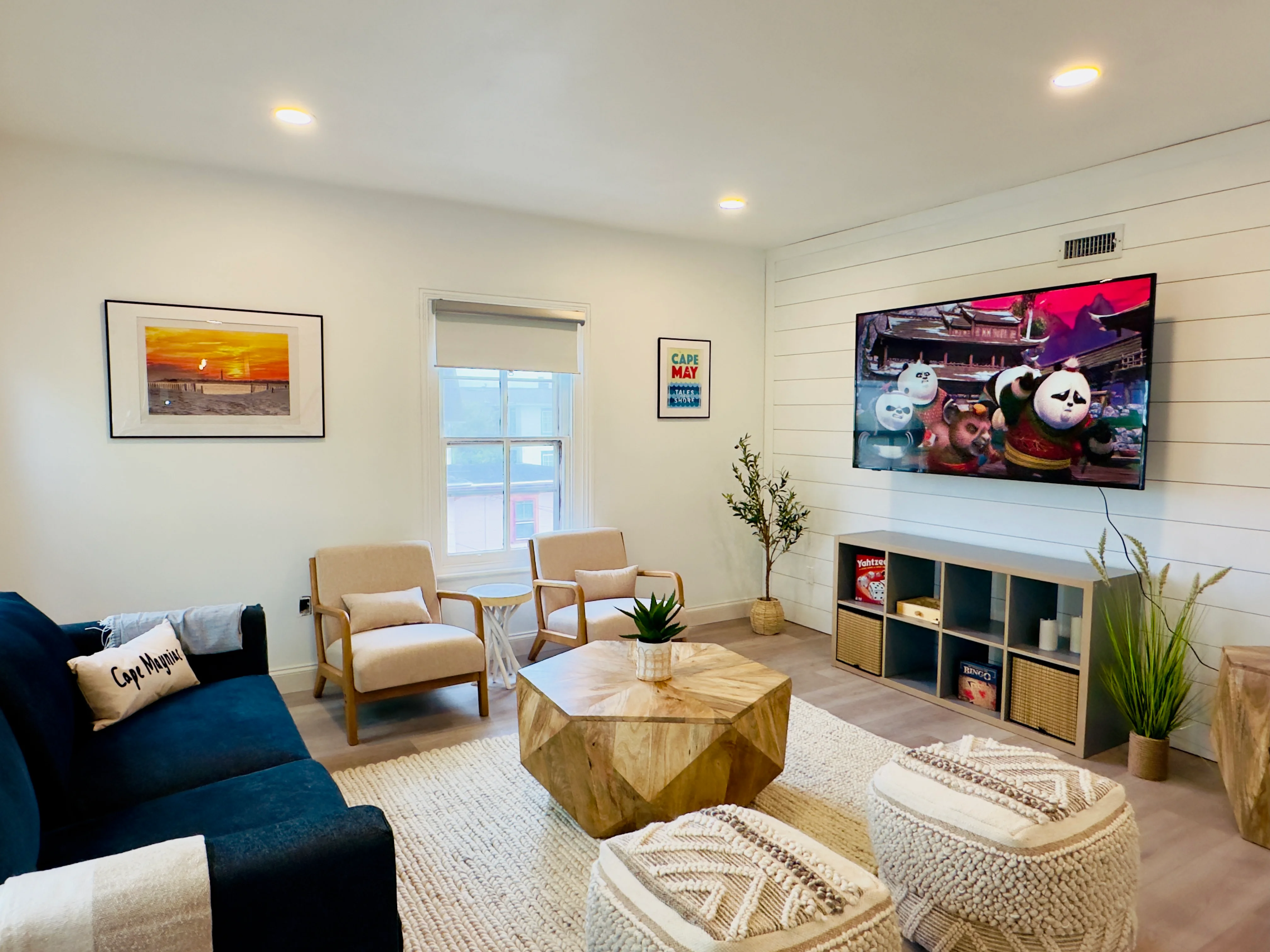 Modern master bedroom with ocean views at Cape May NJ waterfront property with nautical decor and deck access