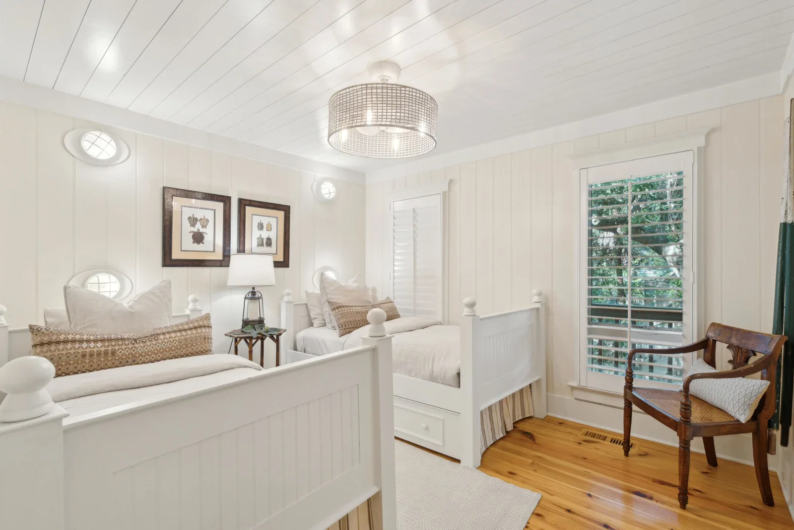 Bright coastal bedroom with twin beds and nautical decor in Kiawah Island SC vacation rental