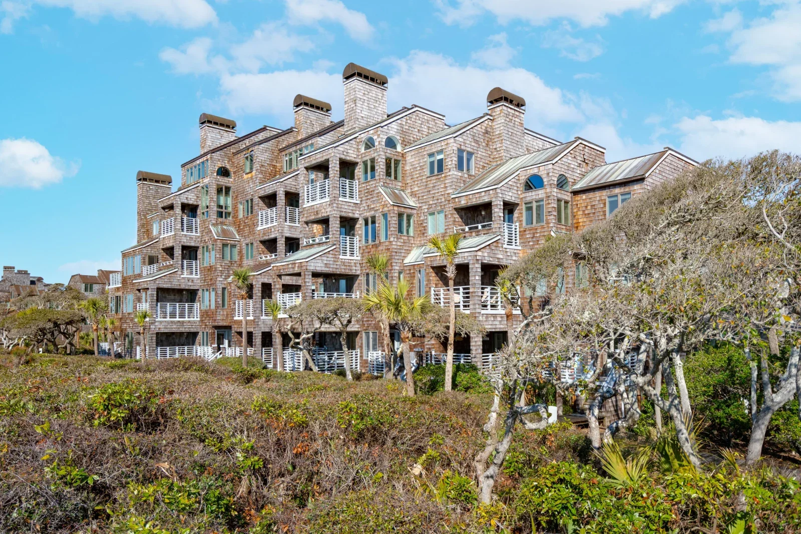 Oceanfront luxury building with cedar shake architecture and balconies at Kiawah South Carolina rentals