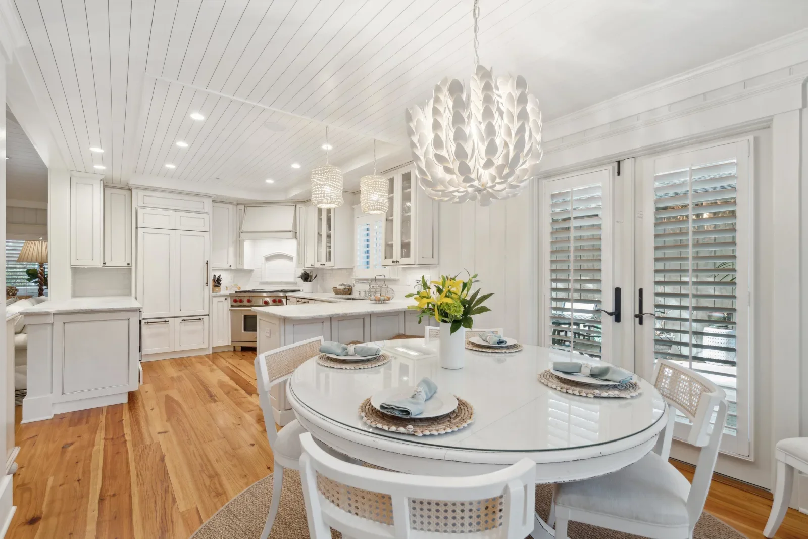 Coastal kitchen with white cabinetry and ocean views at Kiawah Island SC beachfront property