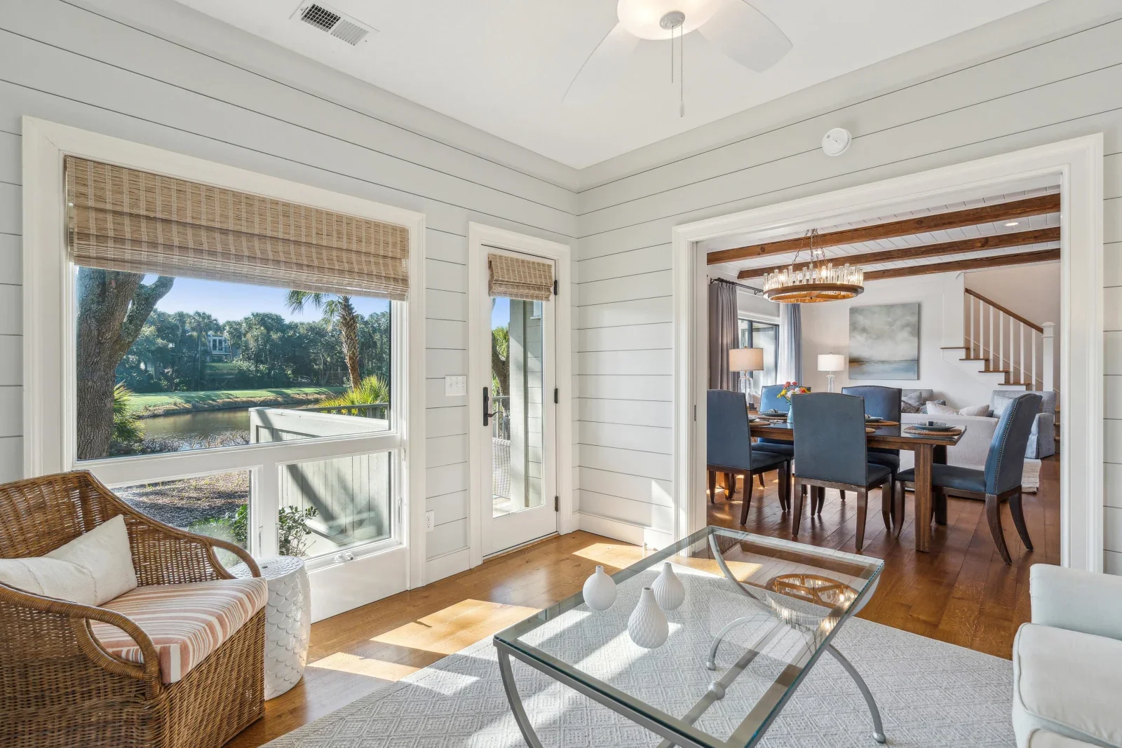 Bright living room with shiplap walls and hardwood floors in Kiawah Island private rental home with waterfront pond views