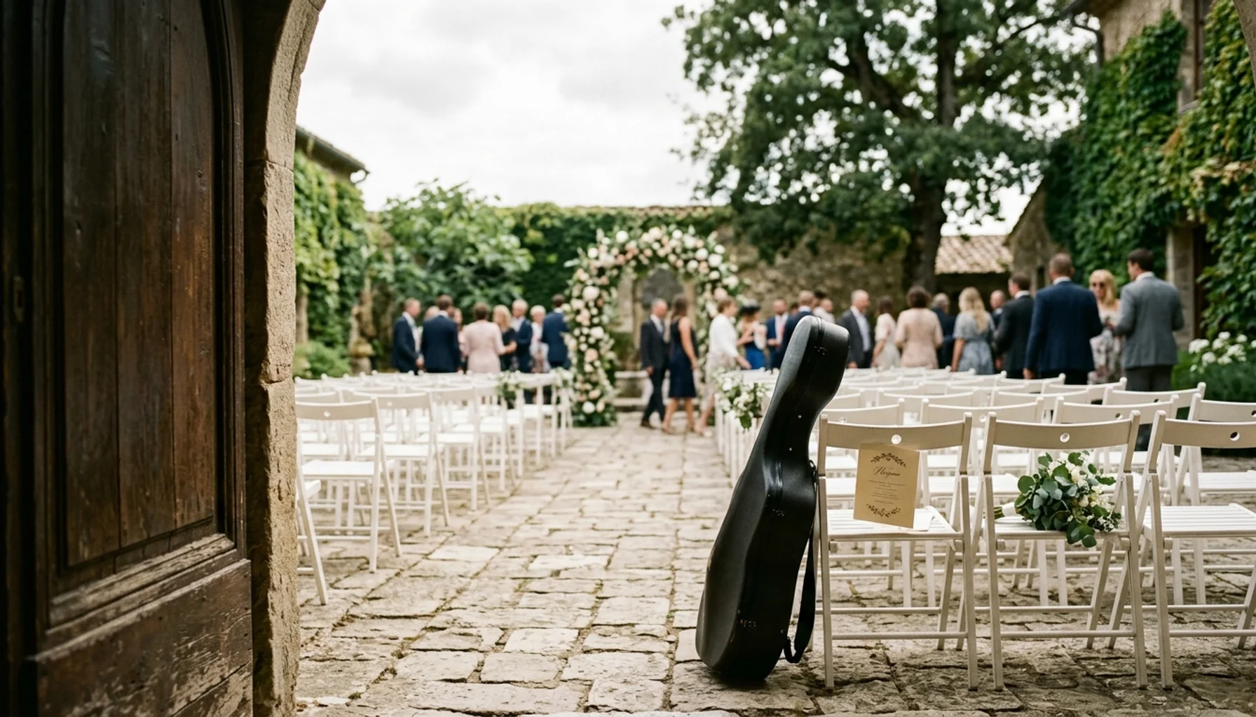 Outdoor wedding ceremony venue with chairs and a cello case — prelude wedding music setting before guests are seated.