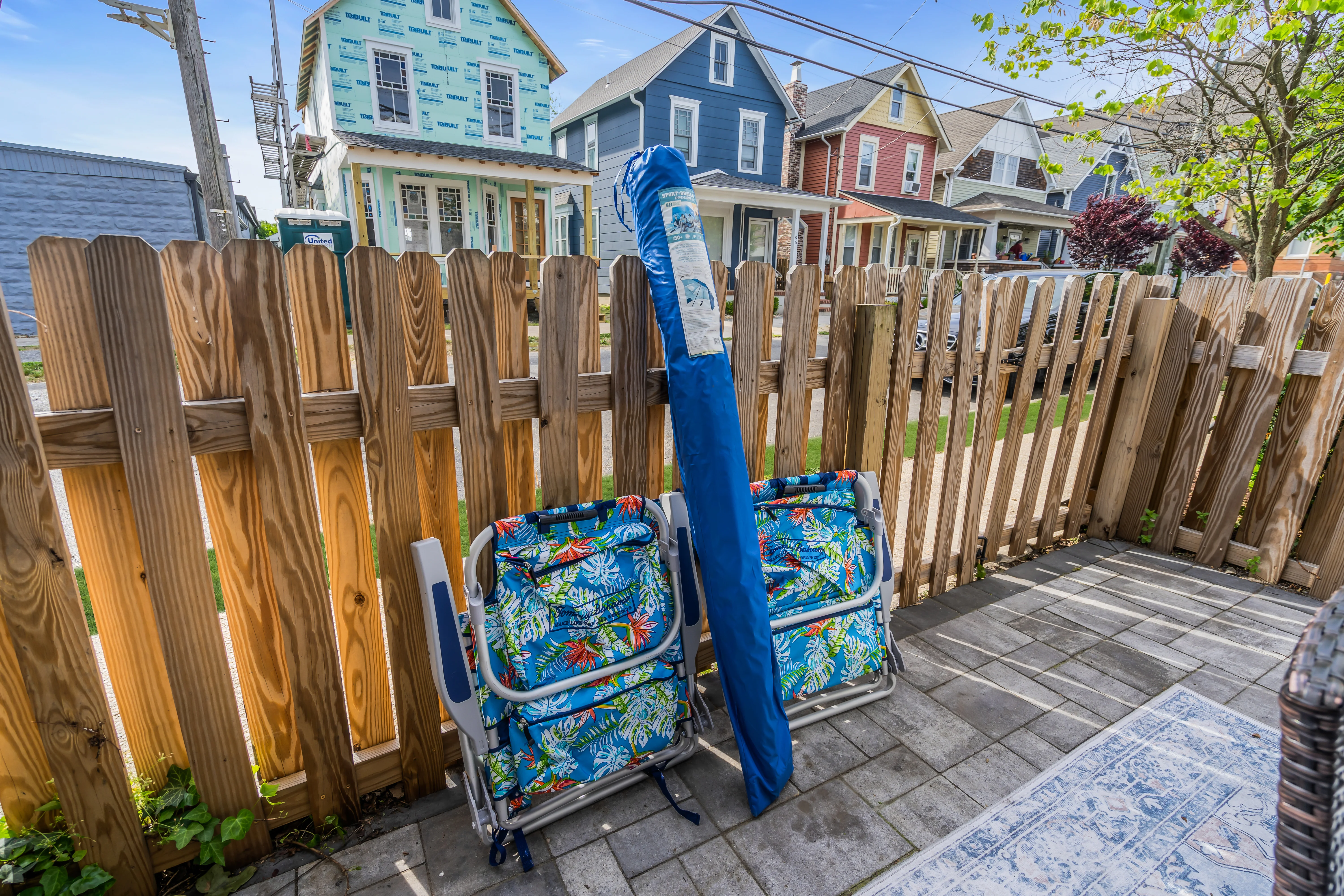 Beach house patio with colorful chairs and waterfront homes in Ocean Grove, NJ