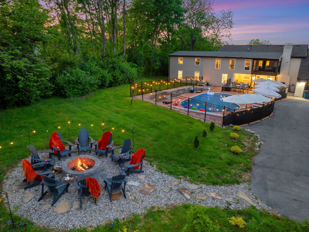 Twilight pool and fire pit at a La Grange home base near seasonal bourbon festivals near Louisville