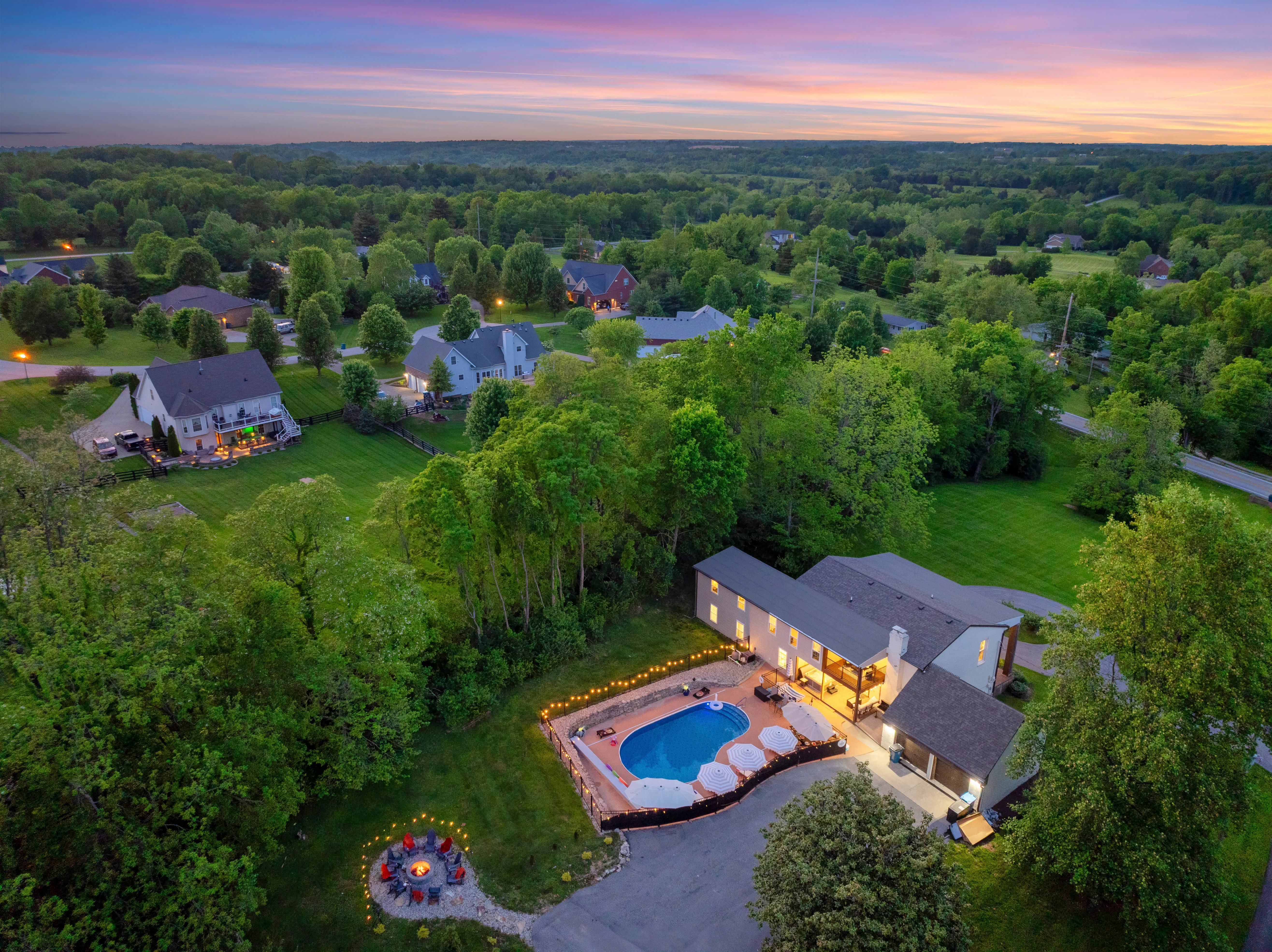 Family vacation Louisville home base with pool and firepit near La Grange KY at twilight