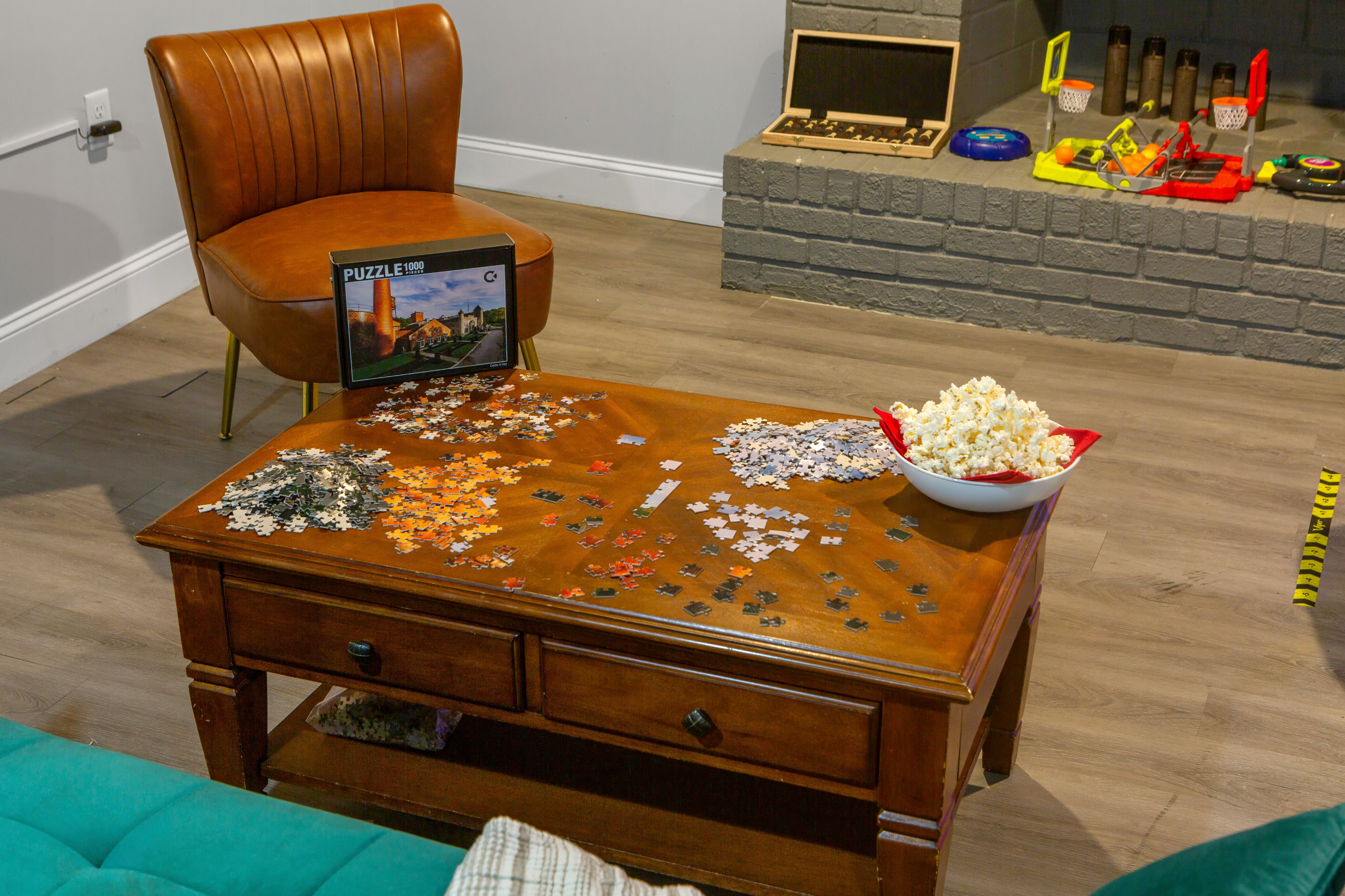 Cozy mid-century modern living room with leather chair and vintage games where to stay in Louisville KY