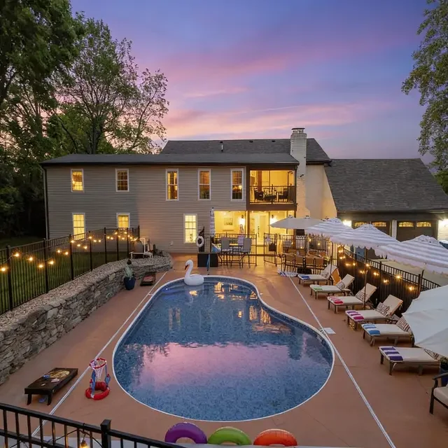Luxurious illuminated home with resort-style pool and firepit for family vacation gatherings near La Grange Kentucky